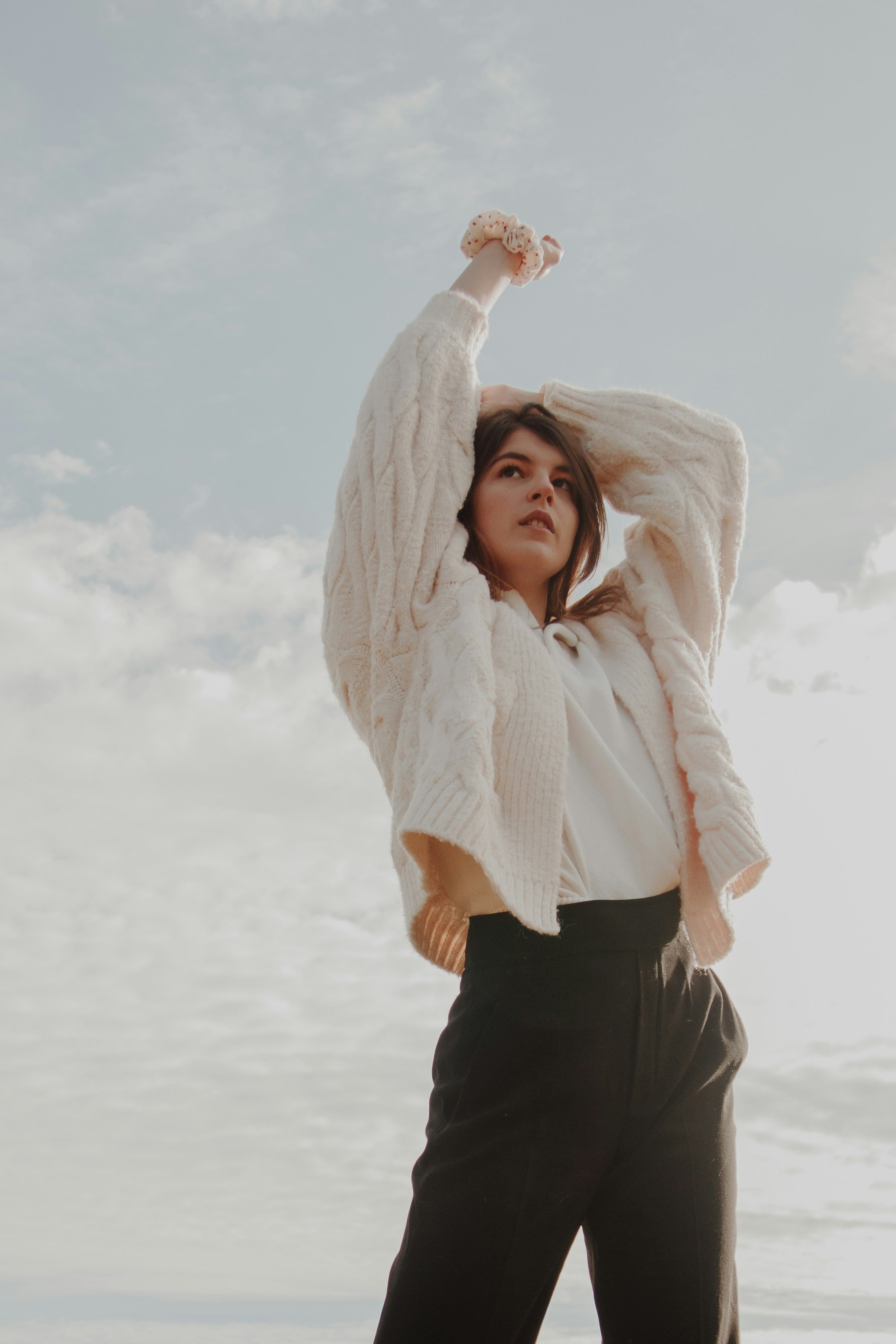 woman in white long sleeve shirt and black pants